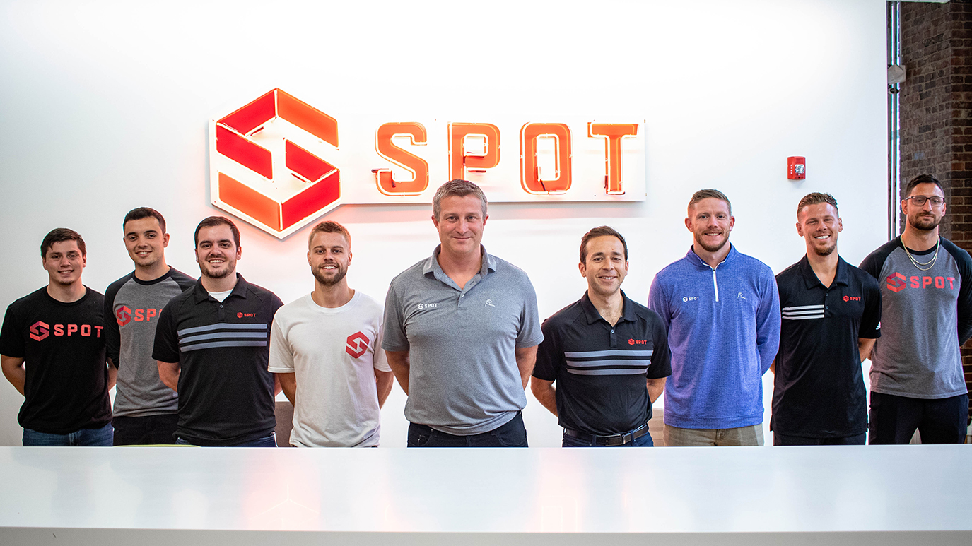Spot employees lined up at a Spot office